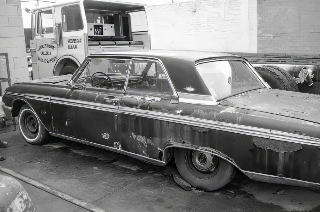 Black Ford with rock